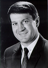 Dr. Philip W. Conn standing in a suit